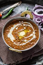 [This flavorful lentil curry is a harmonious blend of black lentils (urad dal) and kidney beans (rajma), slow-cooked to perfection in a luscious sauce. The magic lies in the simmering process, allowing the lentils and beans to absorb the essence of tomatoes, cream, and a medley of aromatic spices] Dal Makhani