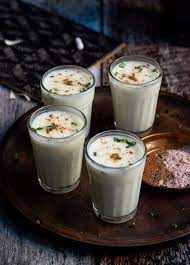 [Lassi is expertly crafted by blending creamy yogurt with water, creating a smooth and frothy base. The classic version, known as Sweet Lassi, incorporates a touch of sweetness with the addition of sugar or honey, offering a harmonious balance to the tangy yogurt] Lassi